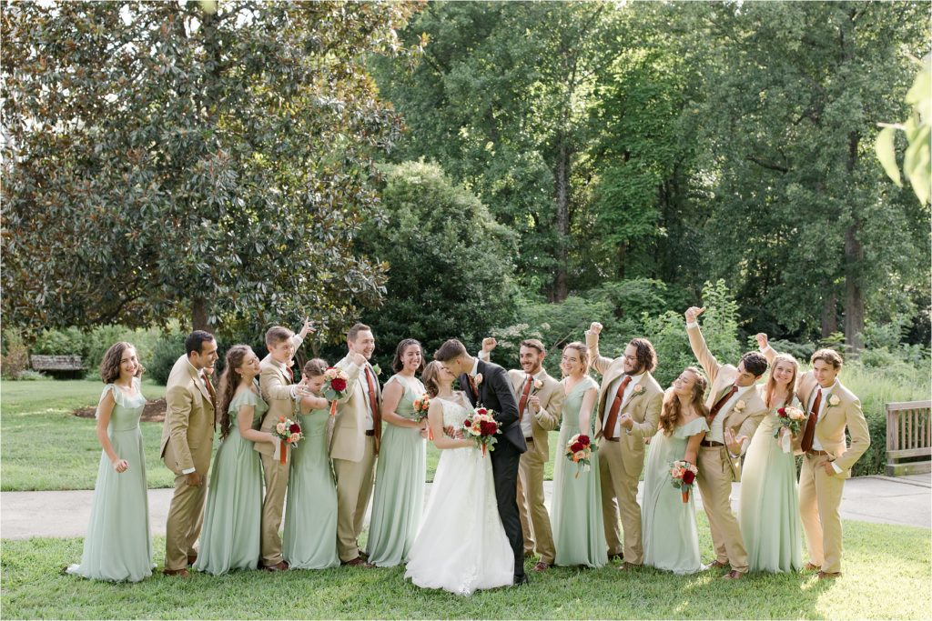 bridal party cheering kiss